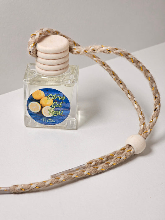 Citrus got real car notes fragrance freshies. Small bottle with a shoe lace type string for hanging and for fragrance distribution 