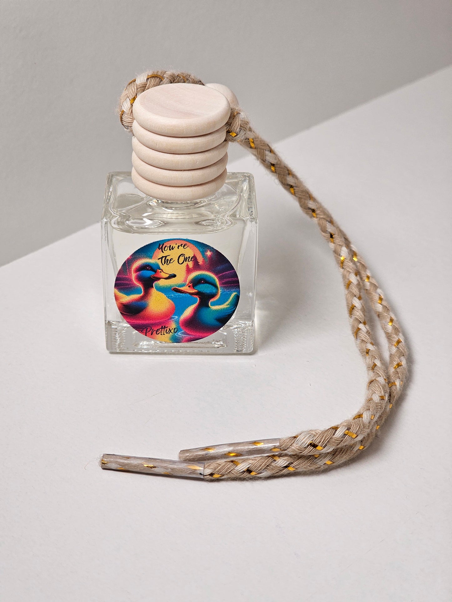 You are the one car notes fragrance freshies. Small bottle with a shoe lace type string for hanging and for fragrance distribution. Duck imagine intended for jeep ducking.